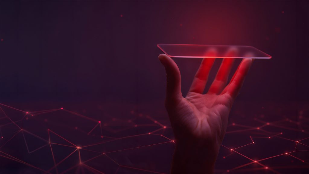 Hand hält eine transparente, schwebende Glasfläche vor einem roten, digital vernetzten Hintergrund